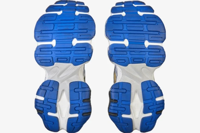 Bottom view of Balenciaga Cargo Sneaker outsoles in blue and white with chunky tread pattern. - SKU 785754W2MV11940