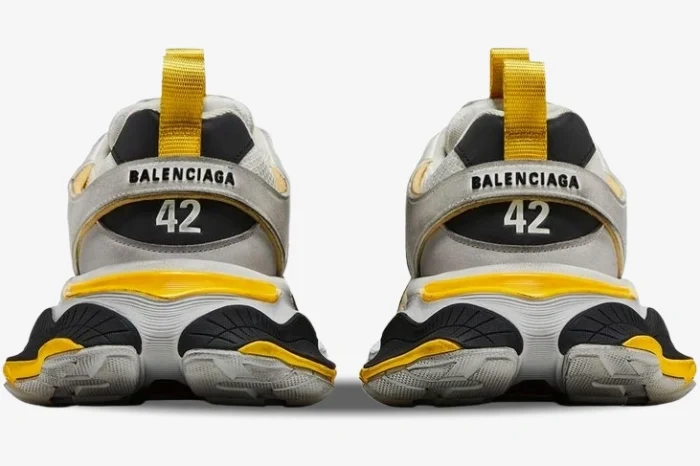 Rear view of Balenciaga Cargo Sneakers in worn-out grey, yellow, and black with size 42 on the heels. - SKU 784341W2MV11170