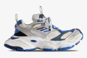 Side view of Balenciaga Cargo Sneaker in white, grey, and blue featuring a distressed, chunky design. - SKU 785754W2MV11940