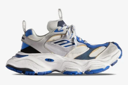 Side view of Balenciaga Cargo Sneaker in white, grey, and blue featuring a distressed, chunky design. - SKU 785754W2MV11940
