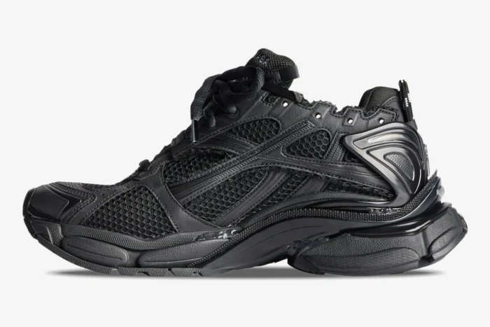 Balenciaga Runner All Black Distressed Sneaker in a side profile view with mesh and layered details. - SKU 772774W3RBT1000