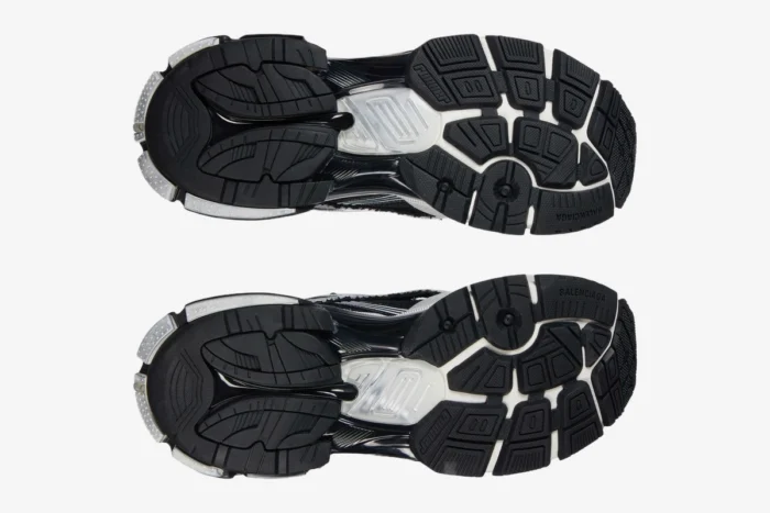 Bottom view of Balenciaga Runner Sneaker Distressed Edition in black and white showing the tread pattern. - SKU 772774W3RMU9010