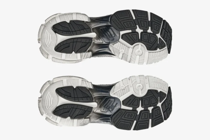 Bottom view of Balenciaga Runner Gradient Sneakers in white and black, showcasing the detailed outsole design. - SKU 677403W3RB19010