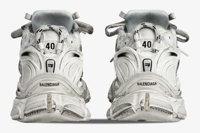 Rear view of Balenciaga Runner Gradient sneakers in white and black with distressed finish and size 40 detail. - SKU 677403W3RB19010
