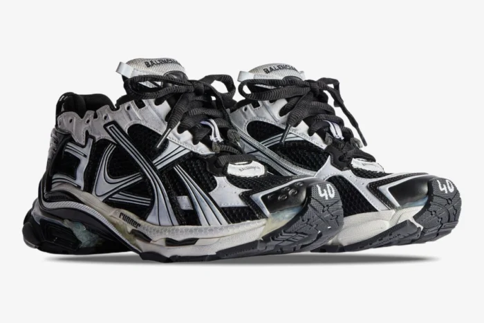 Balenciaga Runner Sneaker Distressed Edition in black and white, side three-quarter view. - SKU 772774W3RMU9010