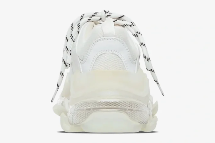Rear view of white Balenciaga Triple S sneakers featuring a chunky clear sole and patterned laces. - SKU 544351W2FB19000