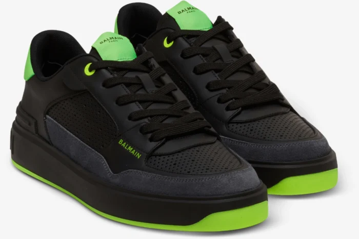 Balmain B-Court low-top sneakers in black and neon green, three-quarter front perspective view. - SKU AM1VI289LSYM