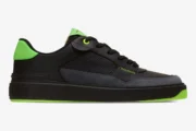 Balmain B-Court low-top sneaker in black and neon green, side profile view. - SKU AM1VI289LSYM