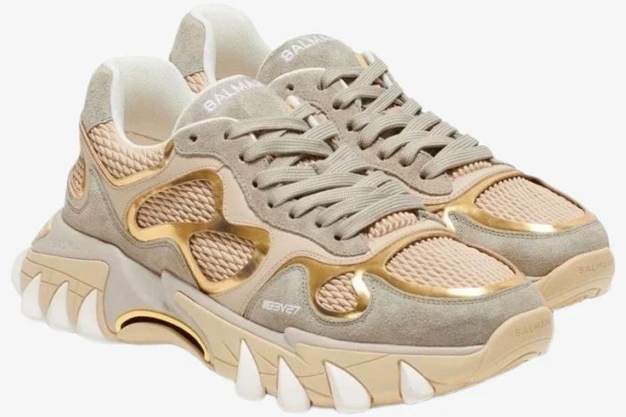 Balmain B-East B3V27 beige and gold metallic sneakers in a three-quarter side view. - SKU B3V27