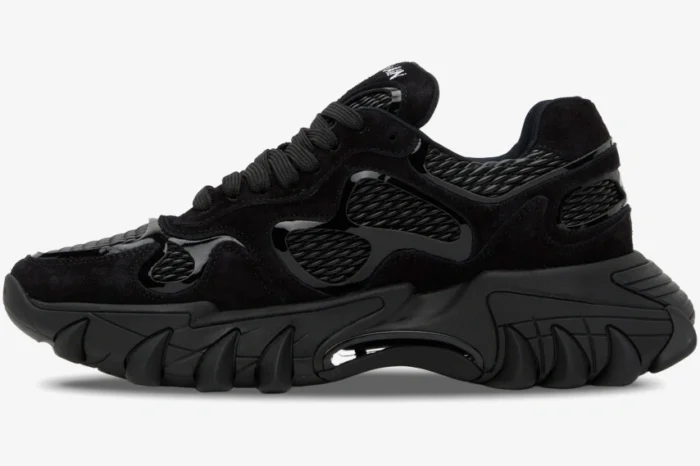 Side profile of a Balmain B-East Low Top sneaker in all black with a chunky textured sole. - SKU AM1VI327THPC-0PA