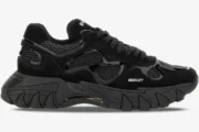 Side view of a Balmain B-East Low Top sneaker in all black with a chunky textured sole. - SKU AM1VI327THPC-0PA