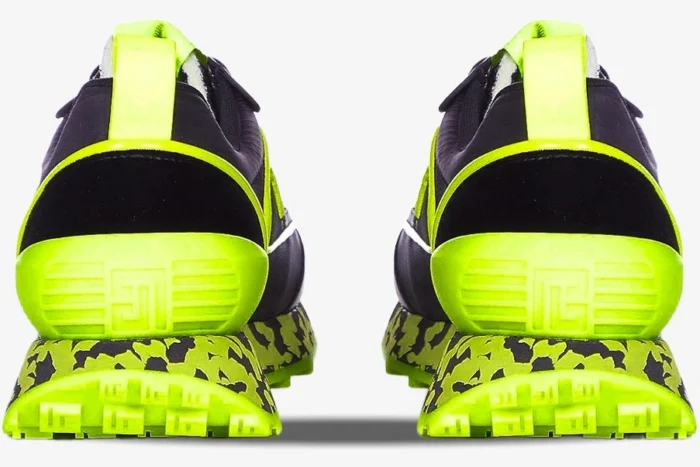Rear view of Balmain B-Racer sneakers in black and neon yellow with a marbled midsole and textured heel. - SKU ym1vi305tvnh