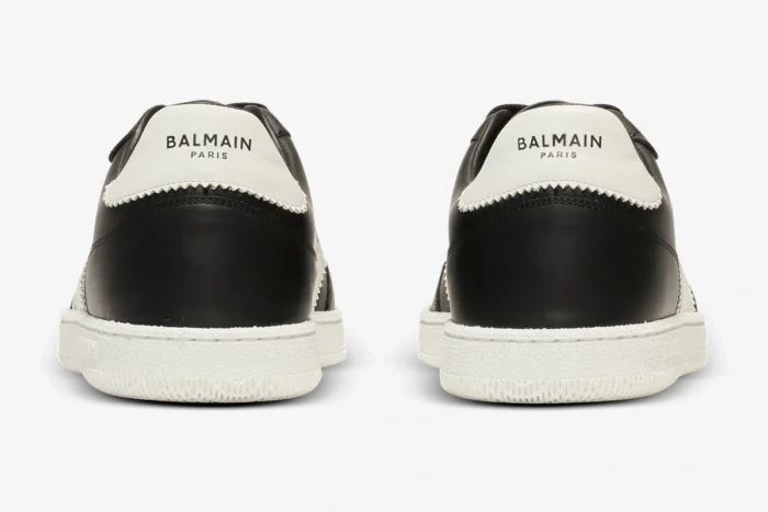 Rear view of Balmain Calfskin Swan Trainers in black and white with logo heel tabs. - SKU EM0VI360LVTR
