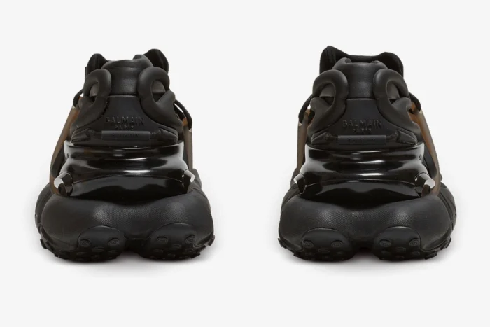 Rear view of Balmain Unicorn chunky sneakers in all black, showing the textured heel and logo. - SKU BM1VJ309KNSC