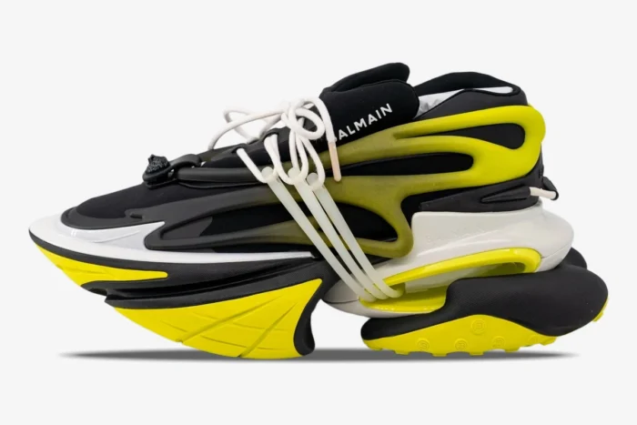 Side profile of Balmain Unicorn Low-Top sneakers in black and neon yellow with a chunky futuristic sole. - SKU YM0VJ309KNET