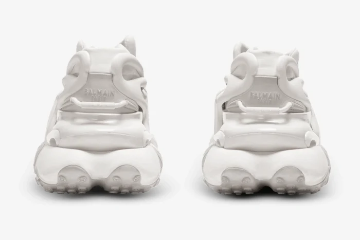 Rear view of white Balmain Unicorn low-top sneakers in neoprene and leather with chunky sculpted soles. - SKU AM0VJ309KNLR