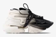 Side view of Balmain Unicorn low-top sneakers with a white and black gradient design and chunky sole. - SKU YM0VJ309KNED-GAB