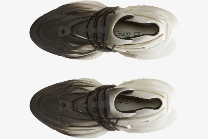Top-down view of Balmain Unicorn Low Top sneakers in a white and black gradient with futuristic sculptural soles. - SKU YM0VJ309KNED-GAB