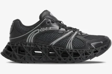 Side profile of a black Dior B35 NXXT sneaker with a 3D-printed lattice sole and mesh upper. - SKU 3SN323ZCY_H968