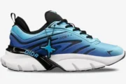Dior B44 Blade x Kaws sneaker in blue cyan gradient, side profile view with chunky white sole. - SKU 3SN306ZEG-H591