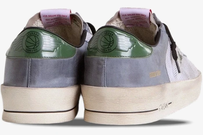 Rear view of Golden Goose Stardan powder blue suede sneakers with green leather logo heel tabs. - SKU GMF00479.F007369.82953