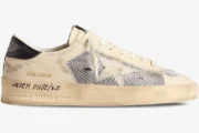 Side profile of Golden Goose Stardan white leather and mesh distressed sneakers with a yellowed midsole. - SKU GMF00580.F004567.10768