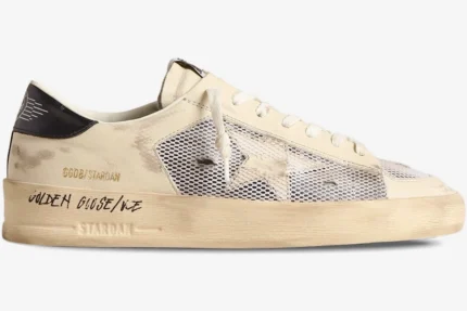 Side profile of Golden Goose Stardan white leather and mesh distressed sneakers with a yellowed midsole. - SKU GMF00580.F004567.10768