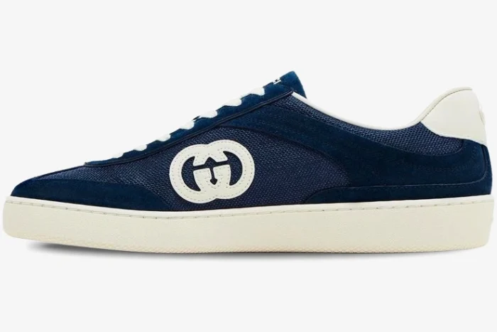 Side view of Gucci G74 sneaker in blue suede and mesh with interlocking G logo and cream sole. - SKU 791742AADM04141
