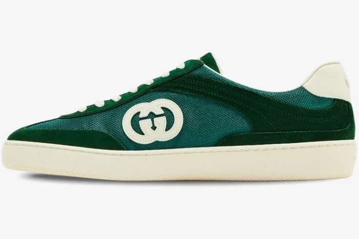 Side profile of a Gucci G74 Interlocking G sneaker in green suede and mesh with an off-white sole. - SKU 791742AADM03143