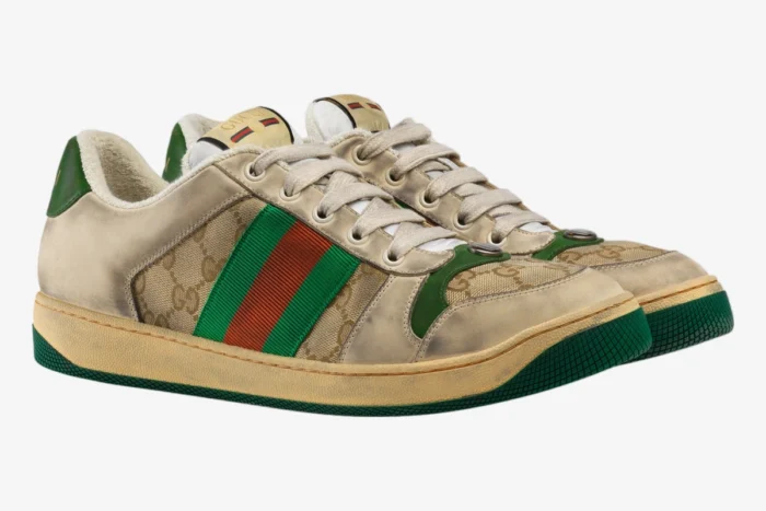 Gucci GG Screener distressed sneakers in beige GG canvas with green and red stripes, three-quarter side view. - SKU 5465519Y9209666