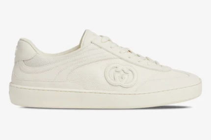 Off-white Gucci Interlocking G sneaker featuring a mesh upper and side logo, side view. - SKU 791742AADM09110