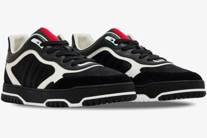 Gucci Re-Web sneakers in black GG canvas and leather, shown from a three-quarter side angle. - SKU 787476AADHW1077