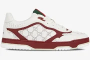 Side profile of a white Gucci Re-Web Sneaker with Rosso Ancora accents and GG monogram pattern. - SKU 850193AAFOO9043