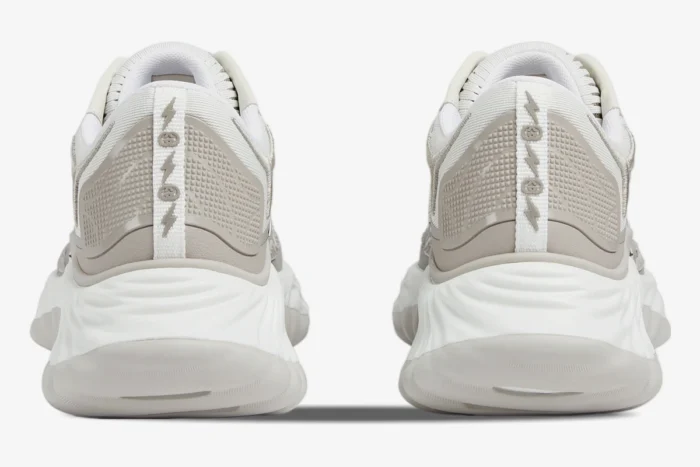 Rear view of Gucci Ripple sneakers in white and grey mesh featuring chunky wavy soles and logo heel tabs. - SKU 787645FADF39046