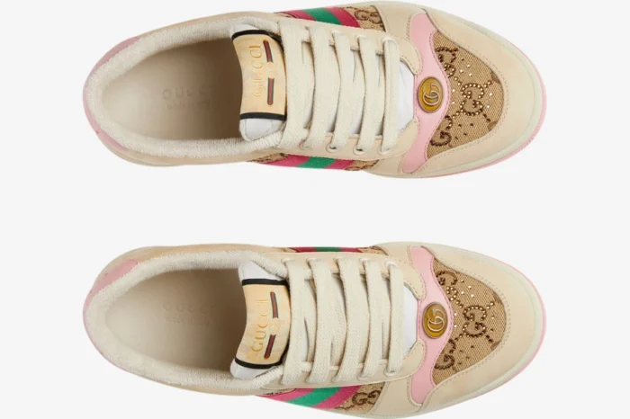 Top-down view of Gucci Screener GG Supreme distressed sneakers in cream and pink with green and red web stripes. - SKU 548950