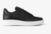 Louis Vuitton Beverly Hills sneaker in black Damier leather with white sole, side profile view. - SKU 1A5UFL