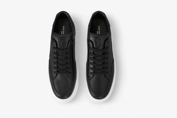 Top-down view of black Louis Vuitton Beverly Hills Damier leather sneakers with white soles. - SKU 1A5UFL