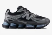 Side view of New Balance Abzorb 2000 sneakers in black and silver metallic with chunky soles. - SKU U2000EA