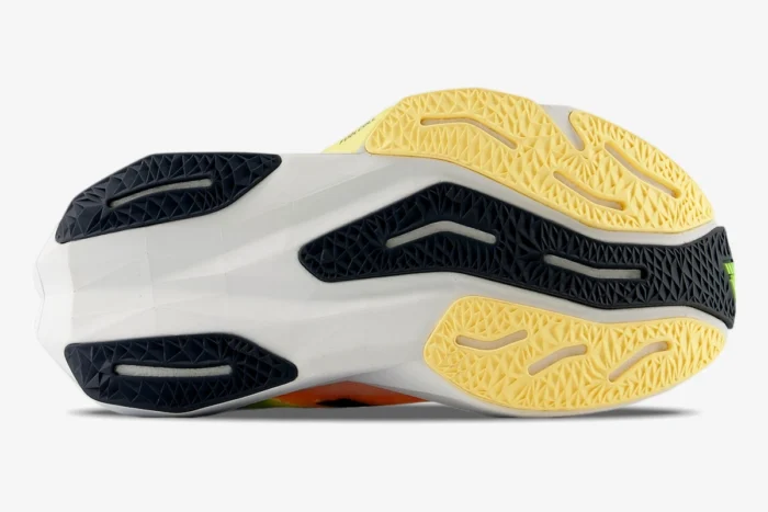 Bottom view of New Balance FuelCell Rebel v4 running shoe in White Lime Green showing the textured outsole. - SKU MFCXLL4