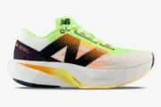 Side profile of New Balance FuelCell Rebel v4 running shoe in white and lime green. - SKU MFCXLL4