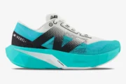 Side profile of New Balance FuelCell Supercomp Elite V4 running shoe in Cyber Jade and black. - SKU WFCXCJ4