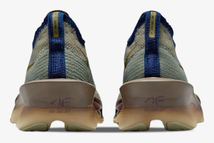 Rear view of Nike Air Zoom Alphafly 3 Premium running shoes in grey, gold, and brown. - SKU HV4318-320