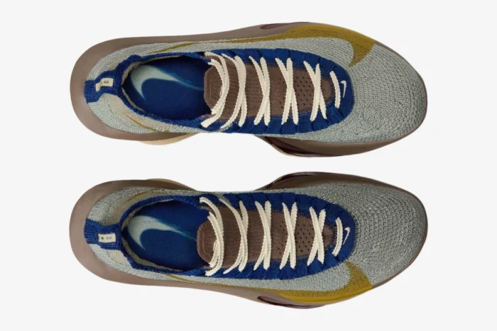 Top-down view of Nike Air Zoom Alphafly 3 Premium running shoes in grey, gold, and brown. - SKU HV4318-320
