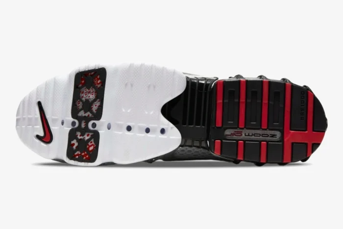 Bottom view of Nike Air Zoom Spiridon Cage 2 Metallic Silver sneaker outsole with red and white details. - SKU CJ1288-001