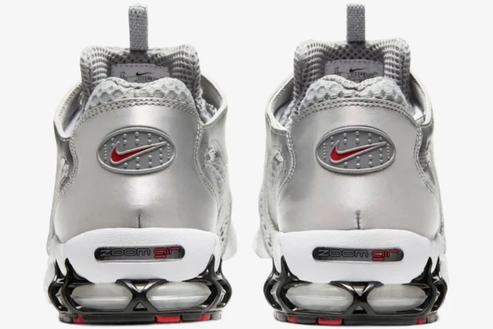 Rear view of Nike Air Zoom Spiridon Cage 2 in metallic silver with red swoosh and zoom air heel. - SKU CJ1288-001