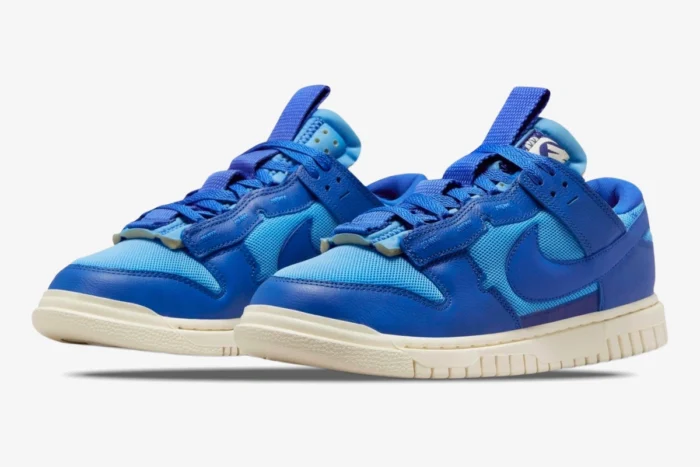 Nike Dunk Low Remastered Jumbo Blue sneakers shown in a three-quarter front view against a white background. - SKU DV0821-400