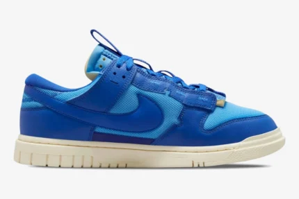 Nike Dunk Low Remastered Jumbo Blue sneaker in a side profile view featuring various shades of blue. - SKU DV0821-400