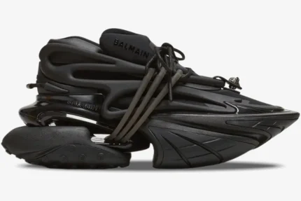 Side profile of a Balmain Unicorn chunky sneaker in all black with a futuristic sculptural design. - SKU BM1VJ309KNSC