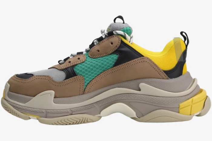 Side profile of Balenciaga Triple S Curry sneakers in brown, yellow, and tan with a chunky sole. - SKU 533882W09O22311