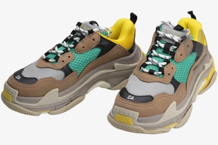 Balenciaga Triple S sneakers in 'Curry' brown, yellow, and tan, three-quarter front view. - SKU 533882W09O22311